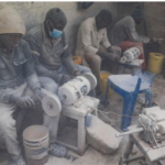: A market in Kenya with people shopping as prices rise.