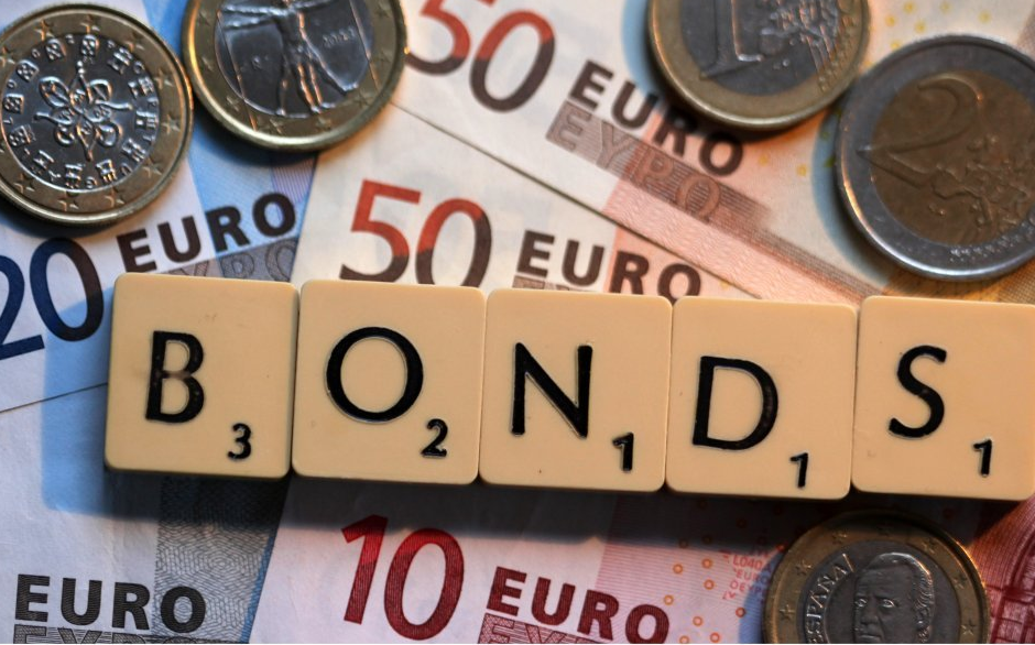 Financial analysts discussing Kenya's bond market reforms.