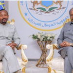 Ethiopian and Somali leaders shaking hands after diplomatic talks to restore relations and cooperation.