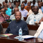 Kenyan tea plantation with workers harvesting tea leaves, reflecting the challenges faced by the tea industry due to reduced exports to Sudan.