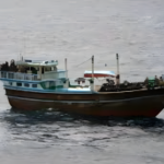 A fishing boat sailing in the Gulf of Aden, symbolizing the challenges of piracy and maritime insecurity in the region.
