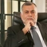 A portrait of Sudhir Ruparelia, Uganda’s richest businessman, known for his success in real estate, banking, and various industries.
