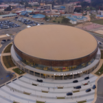 A conceptual image of a modern indoor arena in Tanzania, symbolizing progress in sports and entertainment infrastructure.