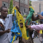 A high-resolution image depicting displaced civilians in the DRC fleeing conflict zones affected by M23 rebel activities.