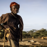Aerial view of a conflict-prone region in the Horn of Africa, showing vulnerable communities and arid landscapes.