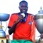 A shopping mall in Kampala, Uganda, with a somber atmosphere, marking the site of a tragic incident involving a Nigerian footballer