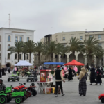 People walking through Martyr’s Square in central Tripoli on May 10, 2025, amid mounting security tensions.