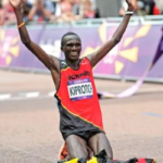 Stephen Kiprotich and Dorcus Inzikuru pose ahead of the Coffee Marathon 2025 in Rwashamaire, Uganda, alongside officials from Inspire Africa Group.