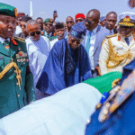 Mourners gather as Muhammadu Buhari’s coffin, draped in Nigeria’s national flag, is laid to rest in Daura, Katsina State