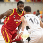 Alpha Diallo of Guinea dribbles past South Sudan defenders during AfroBasket 2025 Group Stage match.
