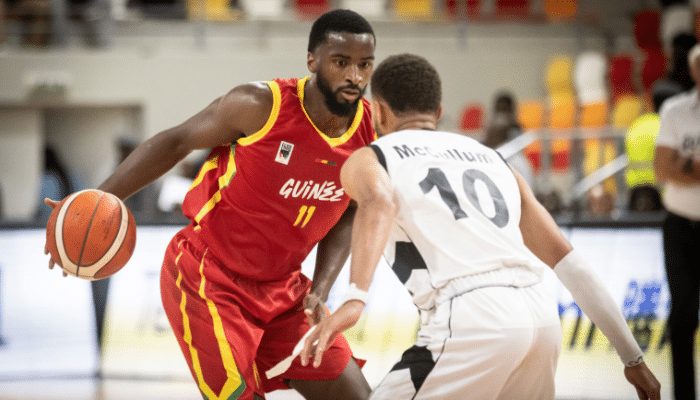 Alpha Diallo of Guinea dribbles past South Sudan defenders during AfroBasket 2025 Group Stage match.