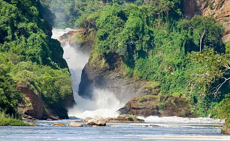 East African Crude Oil Pipeline construction cutting through protected savannah near Murchison Falls, Uganda.