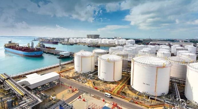 Former Nigeria’s petroleum minister Timipre Sylva attending an official event in Abuja, wearing a coat and neck scarf, amid controversy over an EFCC wanted notice.