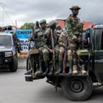 Members of the M23 rebel group standing on vehicles during an event in Goma, North Kivu province, Democratic Republic of the Congo, April 7, 2025