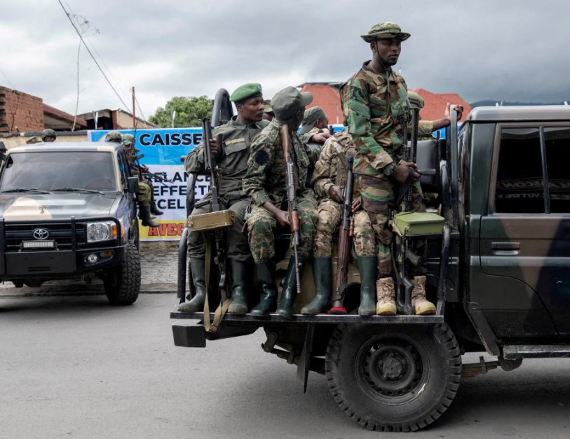 Members of the M23 rebel group standing on vehicles during an event in Goma, North Kivu province, Democratic Republic of the Congo, April 7, 2025