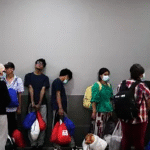 Ghanaian officials discuss the arrival of West African migrants deported from the United States