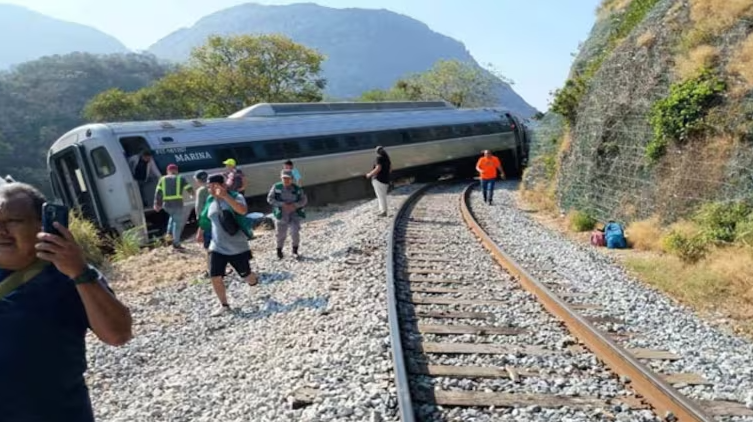 Rescue workers assist injured passengers after a Mexico train crash derailed a passenger train in Oaxaca.