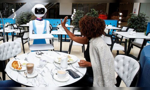 Robot waiters serve food to customers inside a restaurant in Nairobi, Kenya.
