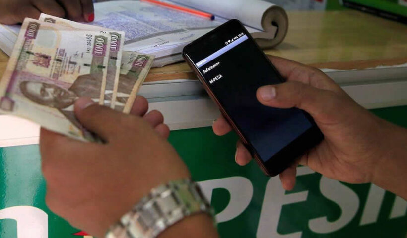 Mobile money users in Africa access digital financial services through their phones.