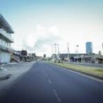 Deserted streets in Dar es Salaam, Tanzania, with police patrolling during Independence Day amid tight security and post-election tension.