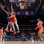 Detroit Pistons players celebrate after edging the Denver Nuggets 109–107 in an NBA road victory