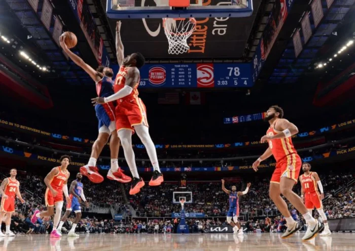 Detroit Pistons players celebrate after edging the Denver Nuggets 109–107 in an NBA road victory