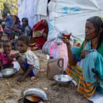 Sudan war 1000 days showing civilians displaced by ongoing conflict.