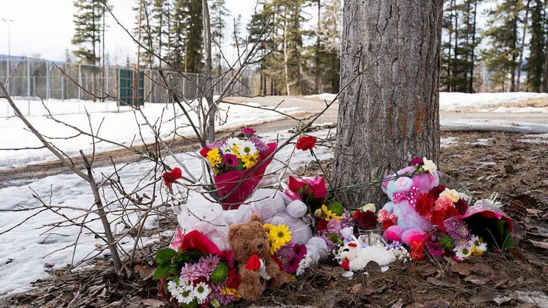 Police officers and emergency responders outside Tumbler Ridge Secondary School after a deadly shooting in Canada.