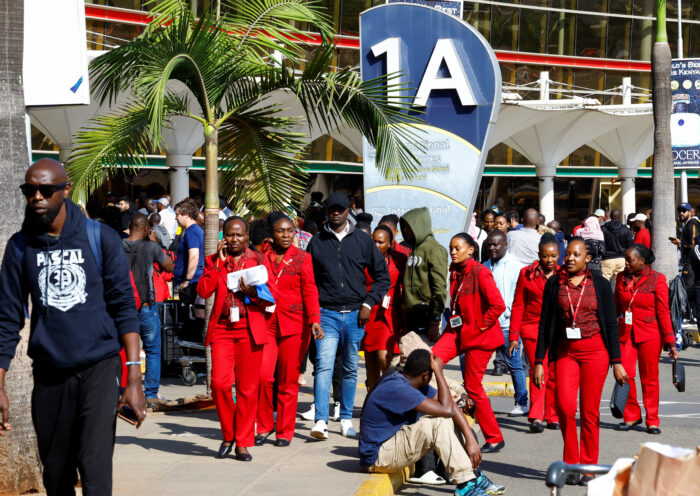 Passengers wait at Jomo Kenyatta International Airport as flight delays disrupt travel in Nairobi.