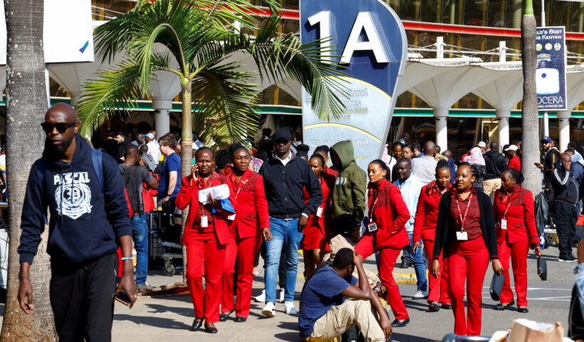 Passengers wait at Jomo Kenyatta International Airport as flight delays disrupt travel in Nairobi.