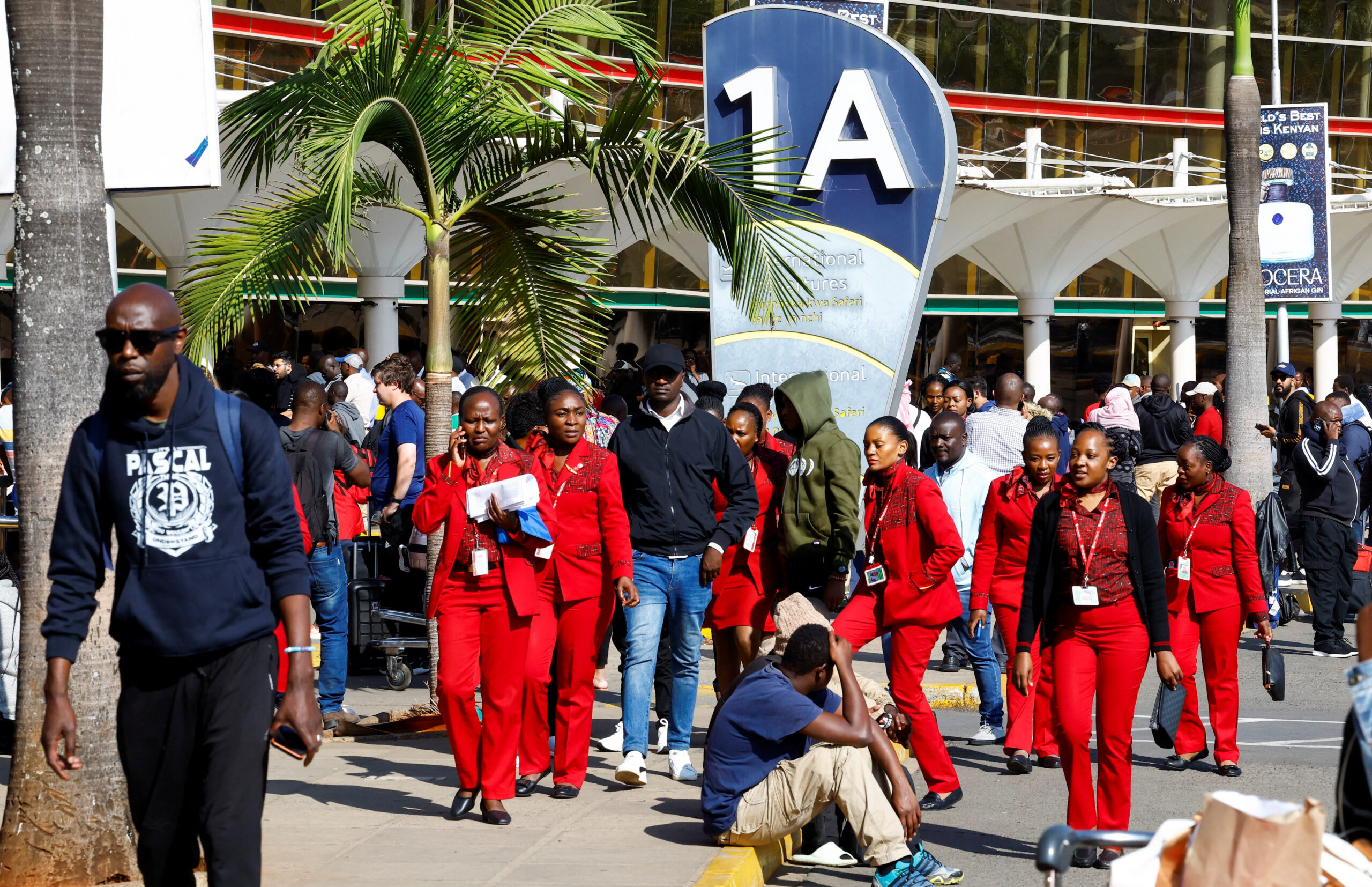 Passengers wait at Jomo Kenyatta International Airport as flight delays disrupt travel in Nairobi.